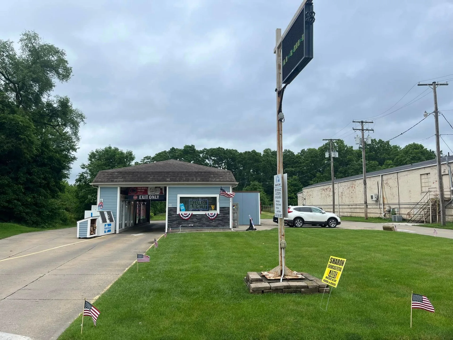 Bear Cave Drive Thru from College Street, with the beverage catering sign out front