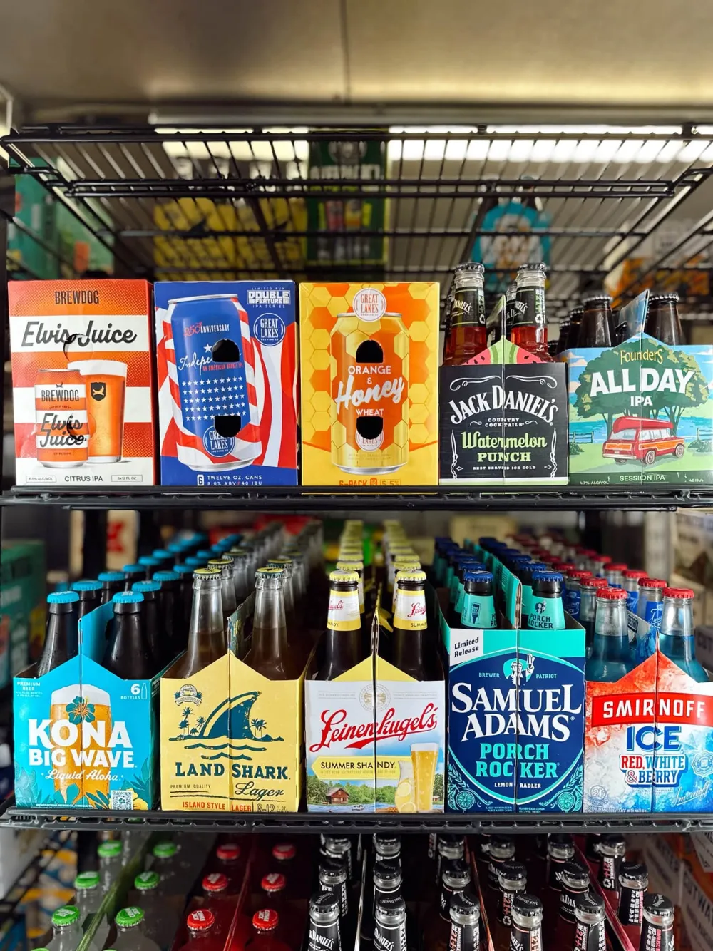 Shelf of summer beer six-packs